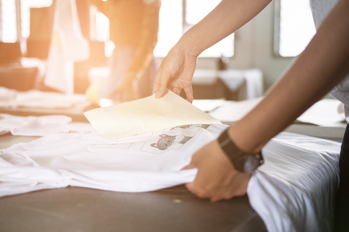 Person Putting Design on Tshirt 